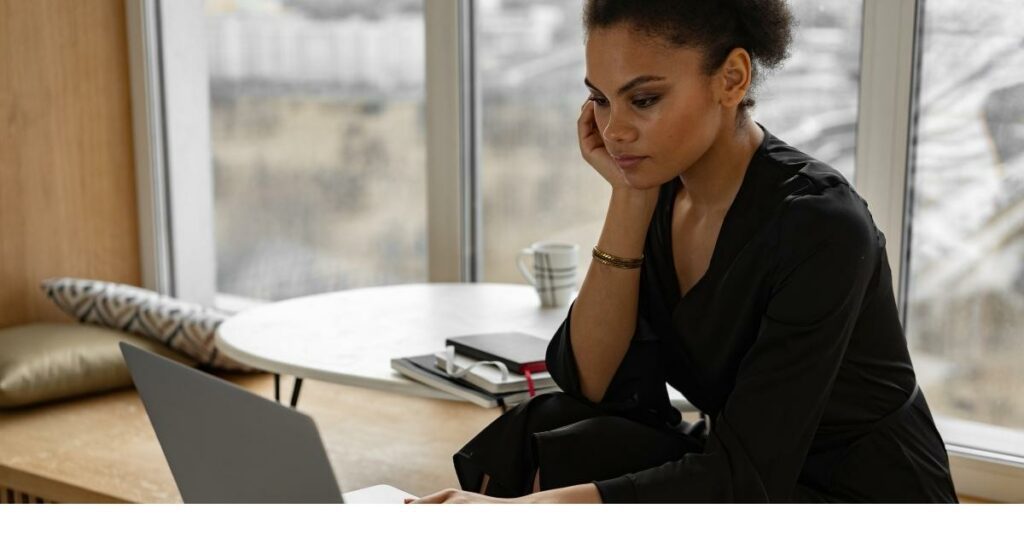 hr career person studying laptop screen intently