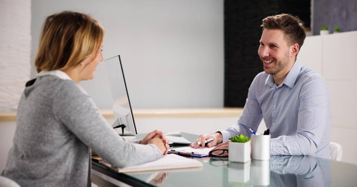 male recruiter talking with a female professional