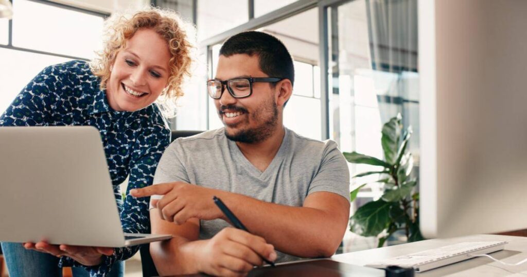 recruiter showing administrative candidate to leader via laptop