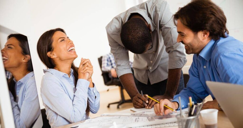 executive assistant joking with leadership team